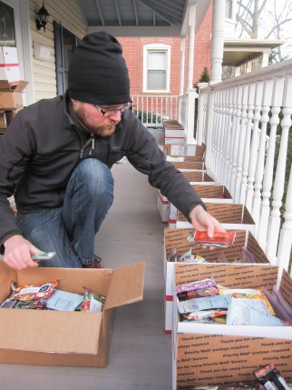 Shutterbug adding to a food resupply box
