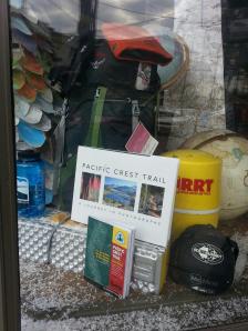 Our PCT book in the window of the Roads, Rivers, and Trails store