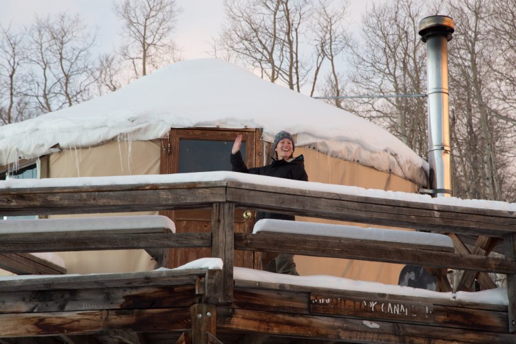 Waving from yurt deck