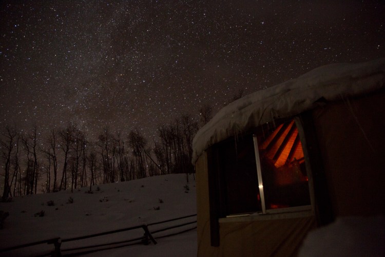 Milky Way and fire glow from yurt