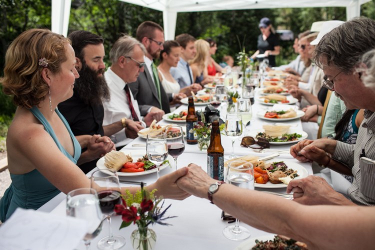 Holding hands and a moment of silence before our meal (photo by Kent Meireis)